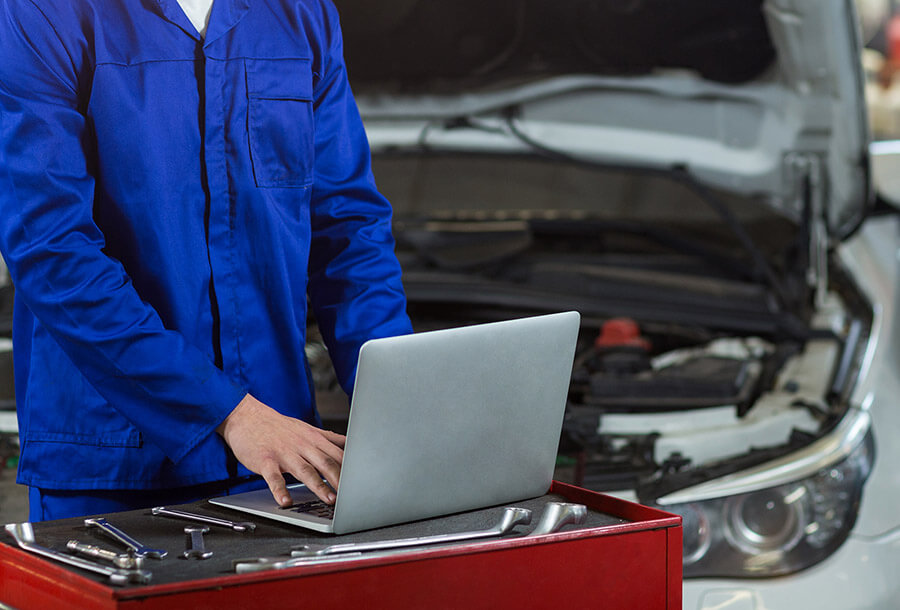 Mechanic using laptop
